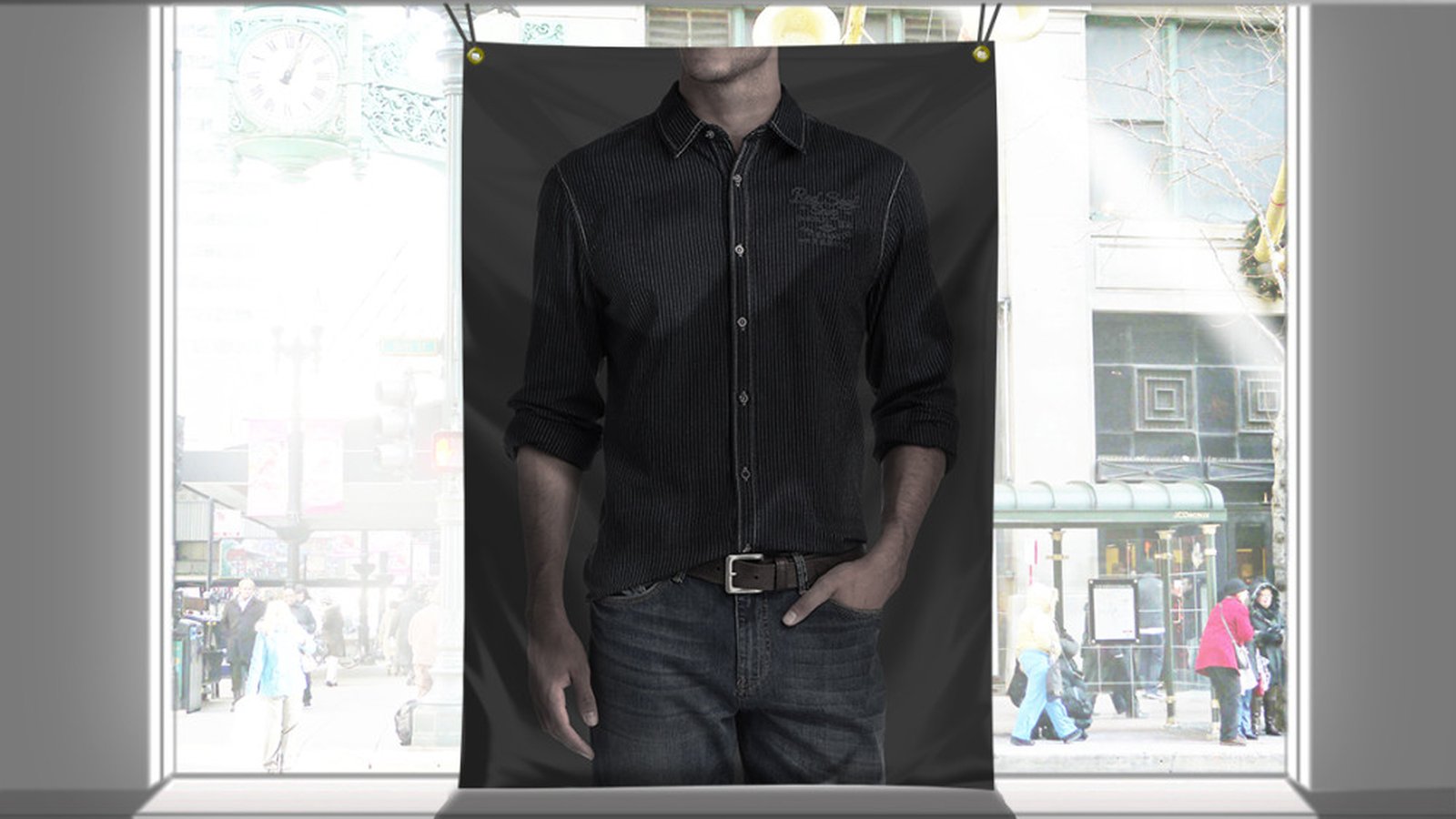 A printed fabric backdrop hanging in front of a bright shop window