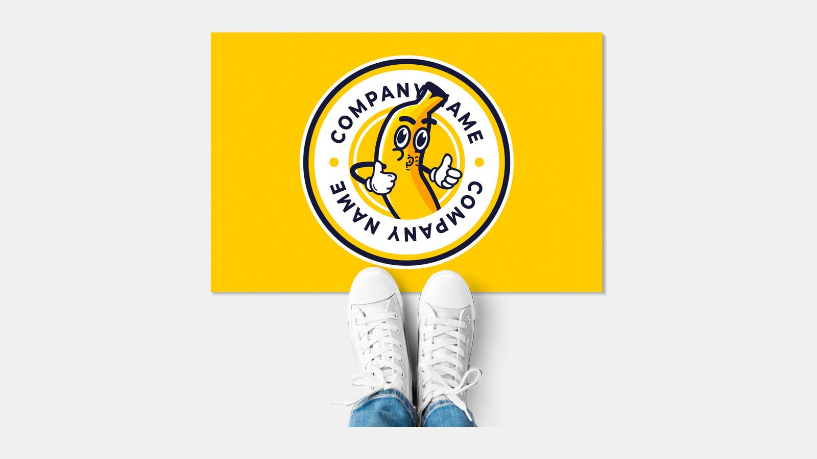 A printed floor decal with a logo, seen from above with a pair of sneakers on it